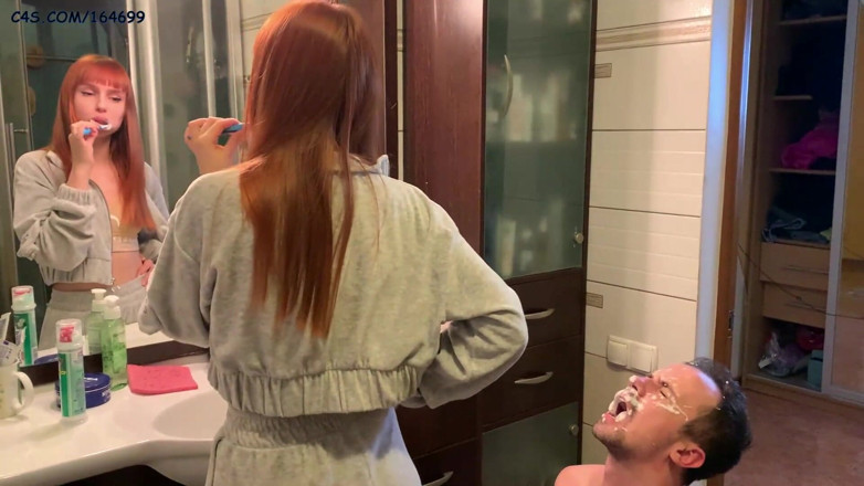 Petite Princesses Femdom: Redhead girl brushes her teeth and spits in slave's mouth -...
