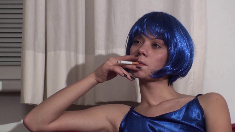 Femdom Austria: Colored hair beauty wearing lingerie and stockings smoking a cigarette