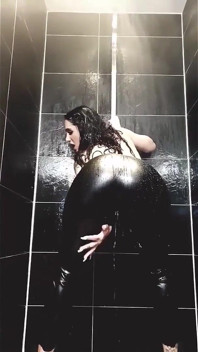 Tattooed MILF Teases Her Curves in Wet Leather