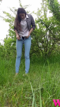 Skinny Brunette Just Had a Pee in the Tall Grass and Now She Puts on Her Jeans and Shoes