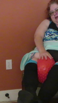Nurse Vicki  plays with a rubber ball in a mini skirt, sexy stockings and high heel mini boots