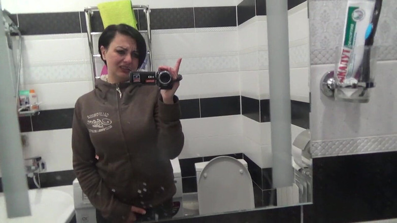 Sexy Milf: Pissing on the toilet long and a lot after long...