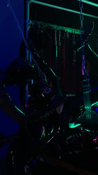 The rubber Domme the giant dildo and the gimp