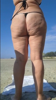 Hot Crown Sunbathing on the Beach in Transparent Micro Bikini