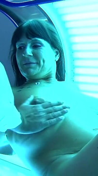 Busty Nadiene Blows Cock in Solarium