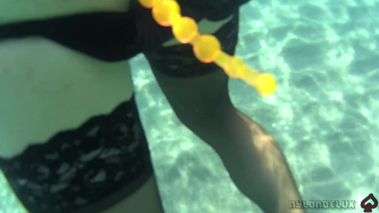 Nylondelux: Black Stocking and Anal Beads in the Sea