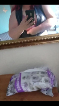 Showing off in a cool lab coat in front of the mirror