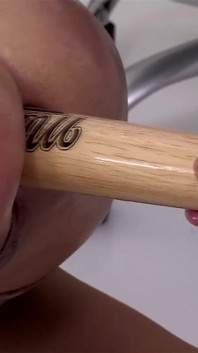 In the office the manager gets fucked by two cocks and a big baseball bat in her ass