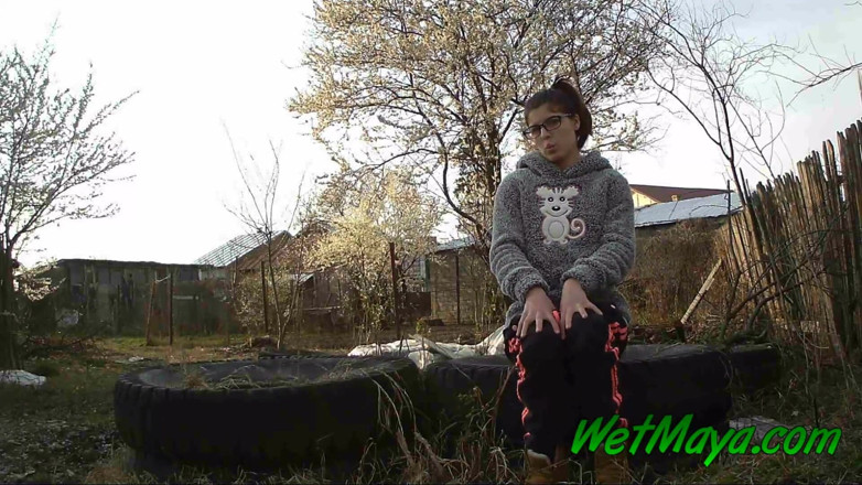 Wet Maya: Peeing on some old tires in the yard
