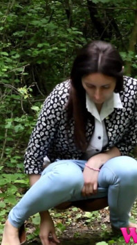 Skinny Brunette Desperate to Pee in the Woods Has to Find a Way to Empty Her Bladder