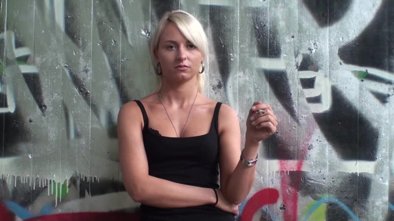 Femdom Austria: Lovely blonde teen smoking a cigarette outdoors