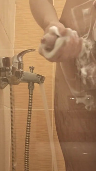 A Young Guy Washes in the Shower and Dreams of Someone Being Next to Him