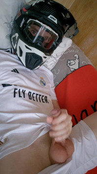 The Guy Is Wearing a Soccer Uniform and Mxhelmet with a Morning Cum