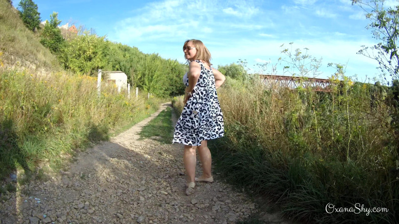MILF Oxana: Flashing and naughty fun at the riverside