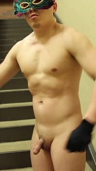 Flexing by the Stairs at the Gym