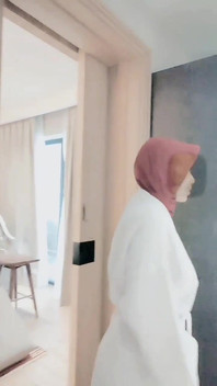 Hijab-wearing Woman Bathes Naked in an Open Swimming Pool
