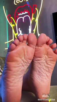 My Bare Wrinkled Soles and Toes on the Table Closeup