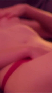 Short-haired blonde Emily masturbates on the bed