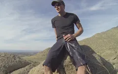 Risky shorts pissing on a hiking trail