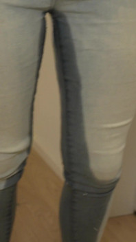 Desperately Wetting Jeans in Front of Busy Bathroom
