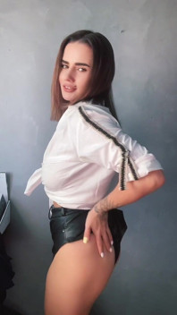 A Brunette in a White Shirt Is Ready to Bare Her Big Breasts