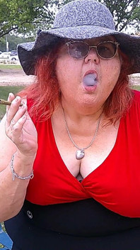 Nurse Vicki Smoking in the Park on a Bench All Dressed up