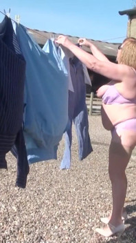 Trisha hanging out the washing