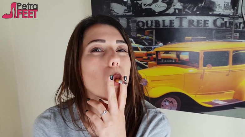 Smokin Fetish: Gorgeous brunette smokes a cigar in her bedroom