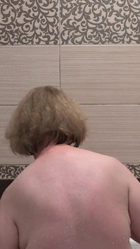 A Mature Stepmom Masturbates While Taking a Shower. a Home Camera in the Bathroom Watches the Chubby MILF.