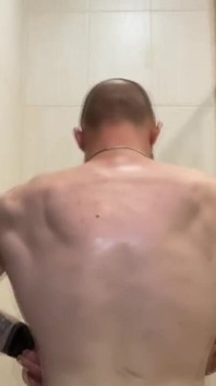 Alpha Shows off His Back Muscles