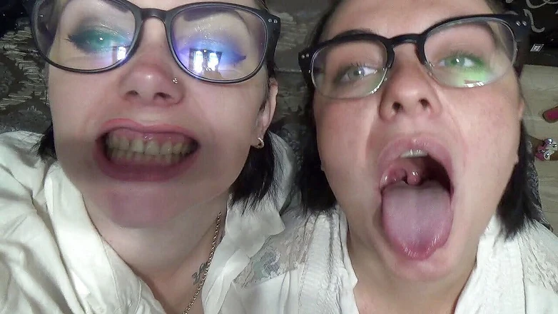 Goddess Misha Goldy: Two business women taunt you with their mouths &amp; tongues before...