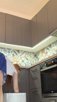 The Juggler Girl Is Here in a Long School Type Uniform Skirt to Flash Her Panties Under Her Miniskirt in the Kitchen
