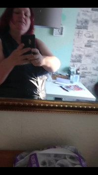 Showing off in a cool lab coat in front of the mirror