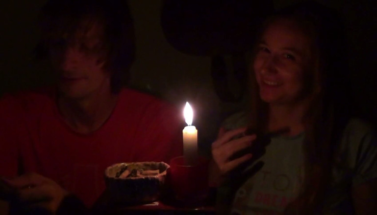 Sensual Lotuses: Couple Smoke Next to Candle