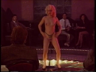 Irresistible Strippers: Blonde stripper bends showing shaved pussy