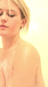Busty teen blonde soaps up and oils her titties