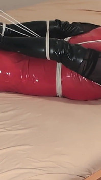 Hot Blonde in Hogtie, Long Latex Gloves, Red Pvc Dress and Stockings Let to Struggle to Get Free.
