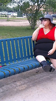 Nurse Vicki Smoking in the Park on a Bench All Dressed up