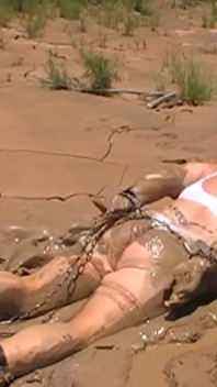 Julie Cunningham in Lingerie Wriggles Hard in Mud Hogtied with Chains. Sploshing Dirty Whore. Huge Tits Covered in Mud.