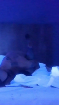 Couple Having Fun in Blacklight