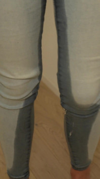Desperately Wetting Jeans in Front of Busy Bathroom