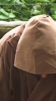 Hooded Mature Man Endures Clamps and Heavy Chains