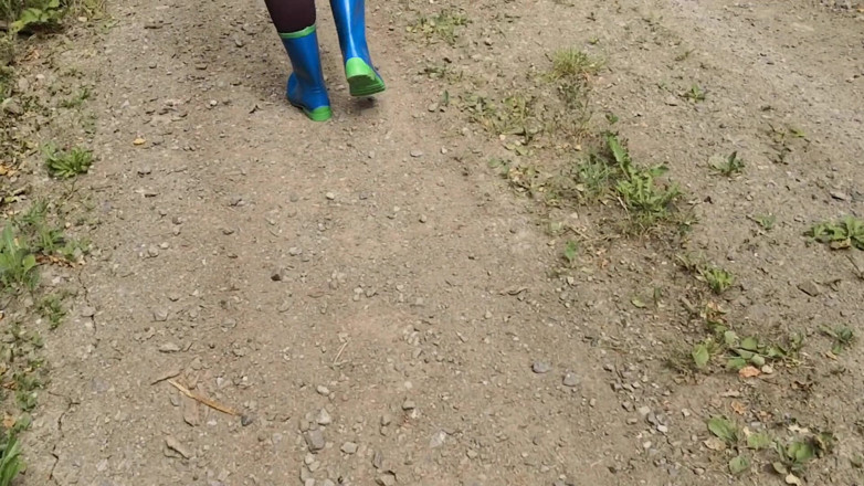 Bouncy Tits Action: Walking in rubber boots