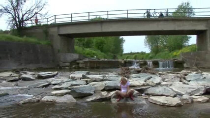 Femdom Austria: Blonde pissing outside in a river