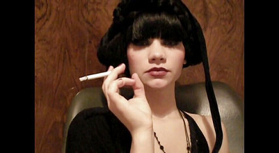 Femdom Austria: Glamorous beauty smoking a cigarette