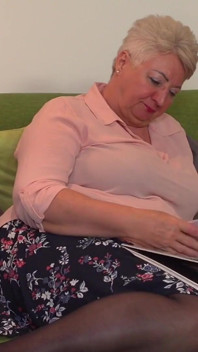Big Butt Granny Astrid Fingers Her Mature Pussy on the Sofa
