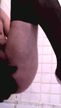 Masked Sissy in Stockings and High Heels Cums in Bathroom