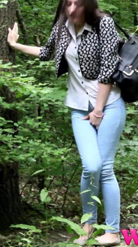 Desperate Brunette in a Forest Holding Her Crotch to Stop Herself From Pissing in Her Jeans