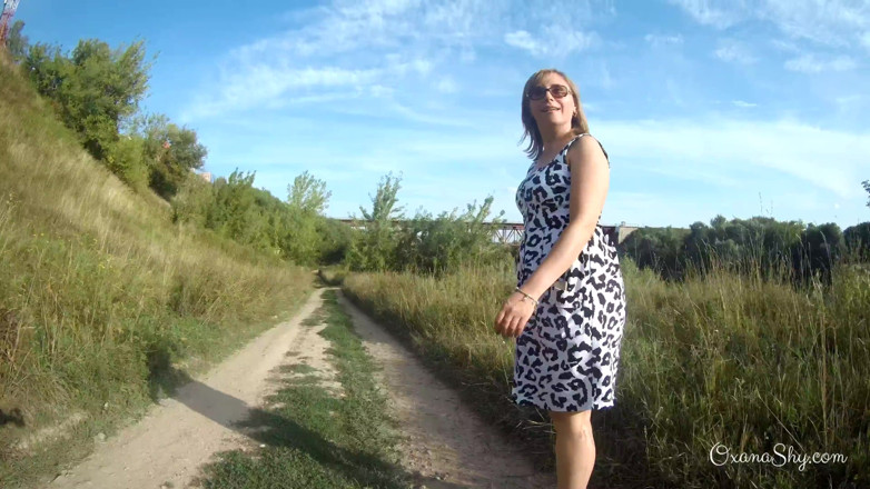 MILF Oxana: Flashing and naughty fun at the riverside