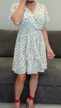 Sadie in a White Dress with Hearts and Red Heels